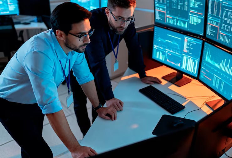 footer-01 imgi-11-it-professionals-analyzing-real-time-data-control-room-23-2152029078